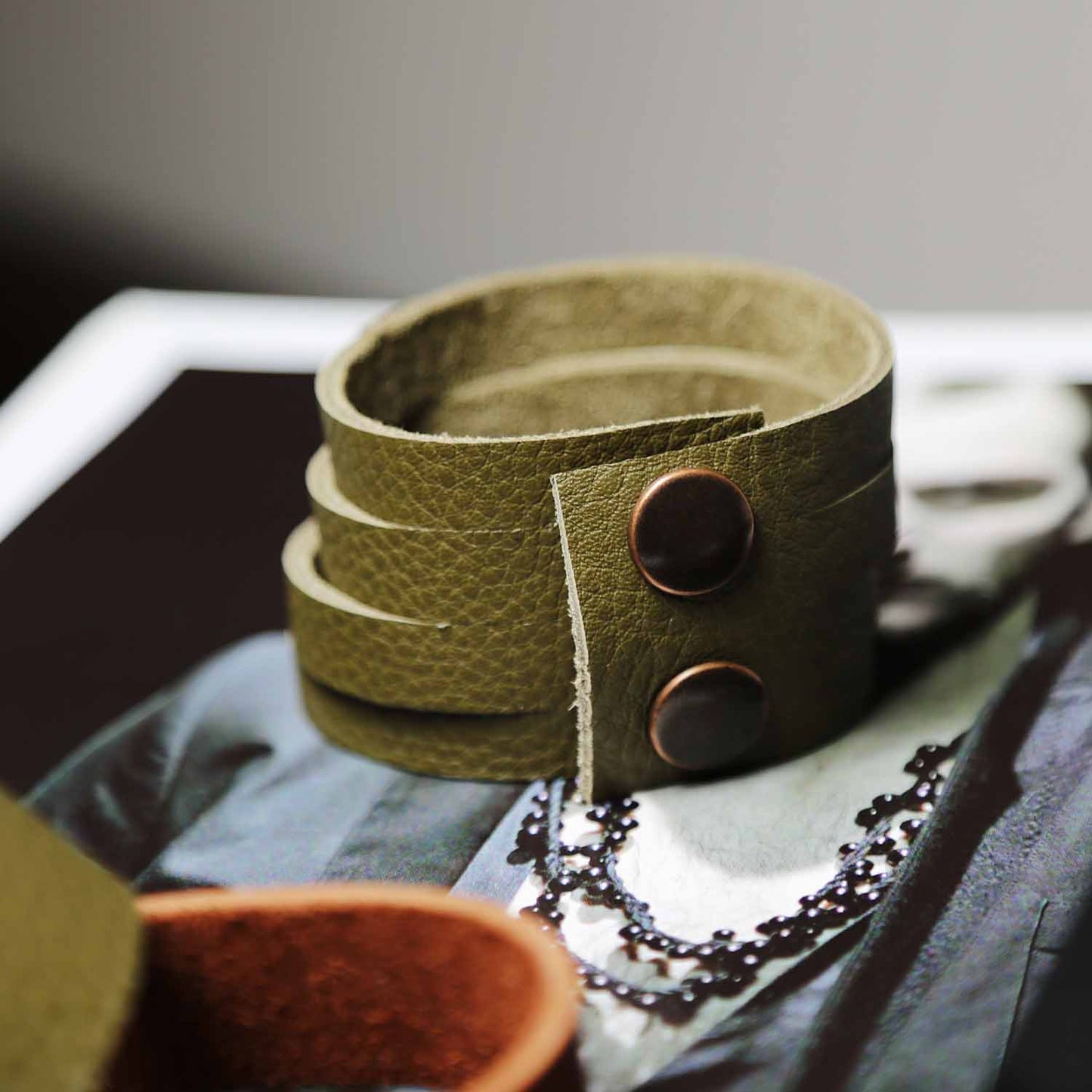 Load image into Gallery viewer, Wide Olive Green Leather Multiple Slit Cuff Bracelet
